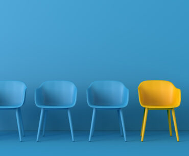 yellow chair standing out from the crowd