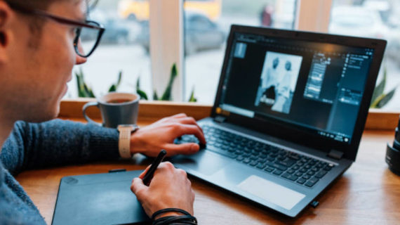 man editing photos on his computer