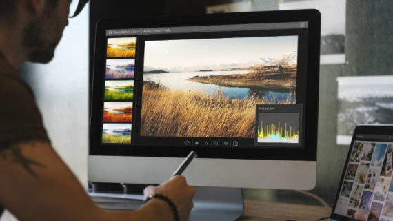 man editing photo on his computer