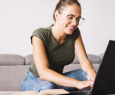 woman typing on her laptop