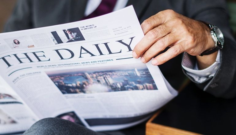 man reading newspaper