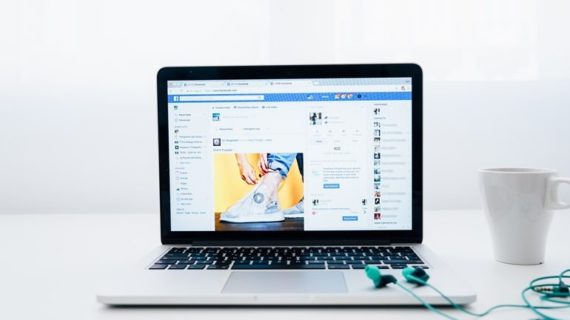 Facebook page on laptop screen