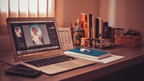 editing photo on laptop