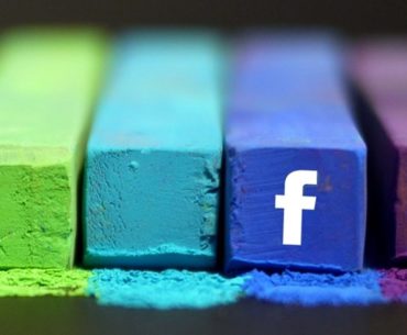 colorful chalks with one facebook logo