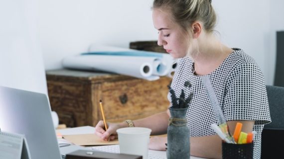 young woman writing