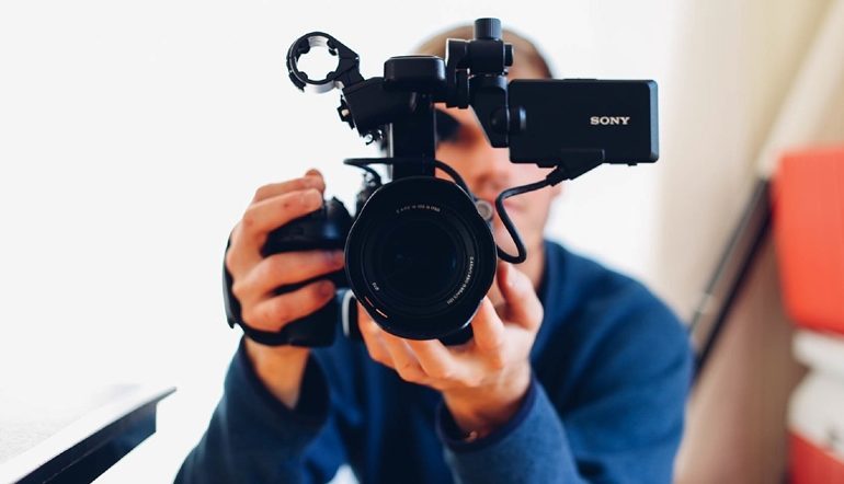 man holding a video camera