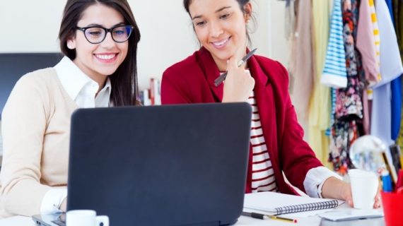 young women working in front of the computer