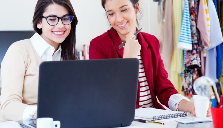 young women working in front of the computer