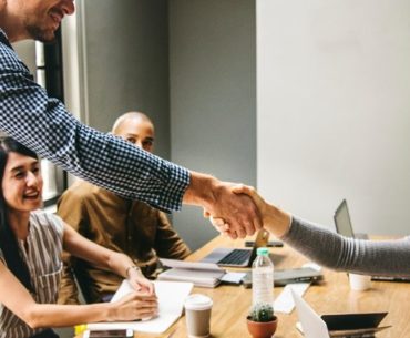 man and woman doing handshake