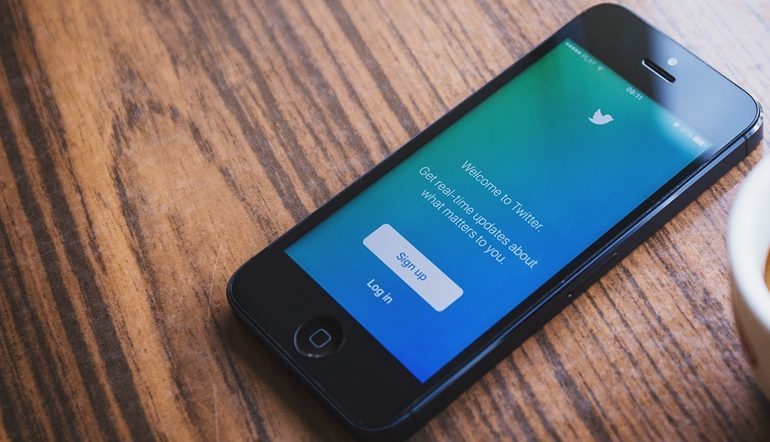 mobile phone with twitter on screen