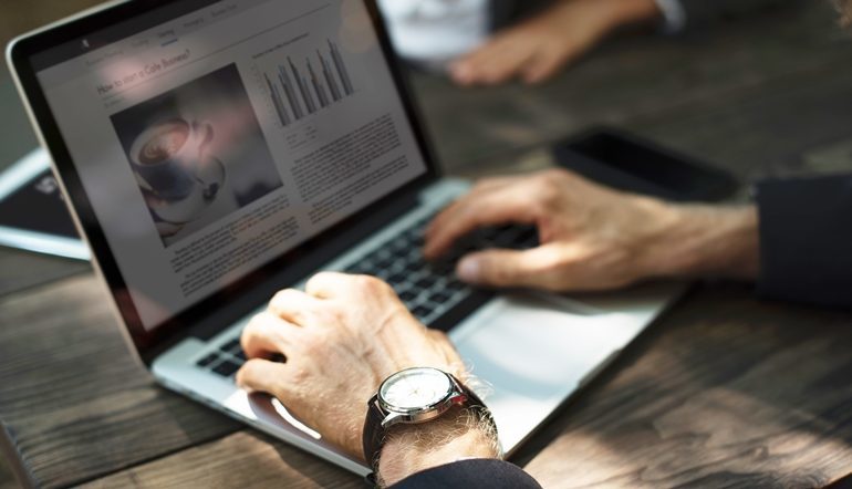 man working using laptop