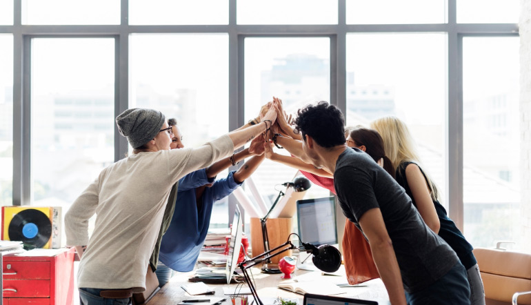 group of people celebrating team work