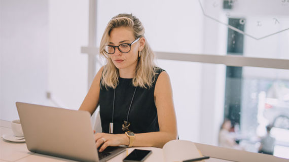 woman using laptop while working