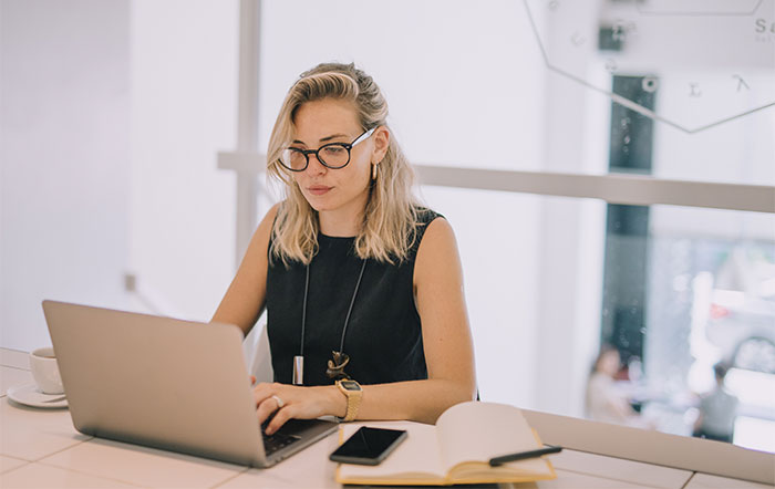 woman using laptop while working