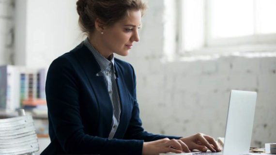 corporate woman working on her laptop