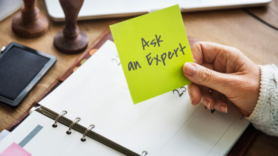 woman holding a sticky note