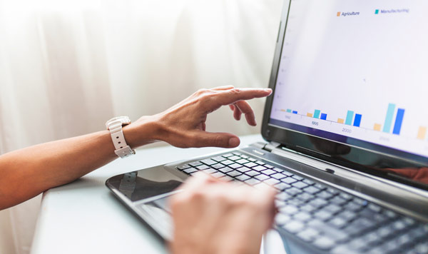 person hand on top of the laptop