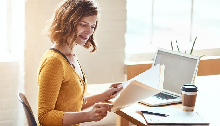 woman proofreading documents