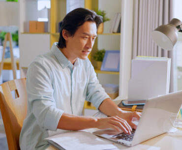 asian man working from home