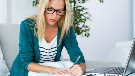 woman taking down notes