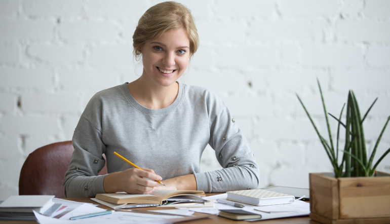 young attractive student at the table