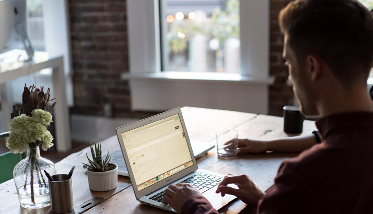 Man at a laptop in an office