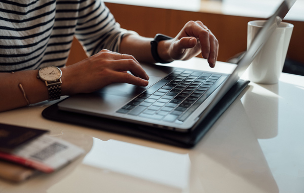 person seated the table while working