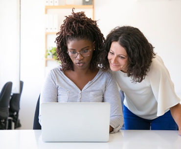 Teaching her colleagues to work online.