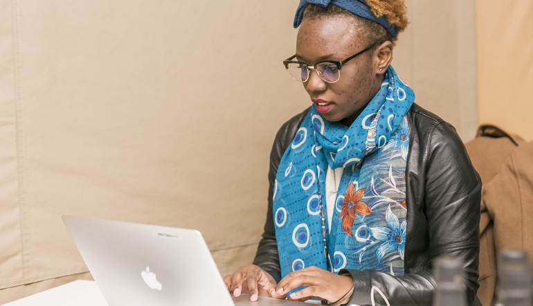 African woman working using with her laptop