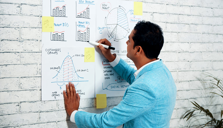 business man drawing diagrams on the wall poster