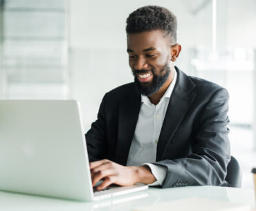 african american businessman using laptop