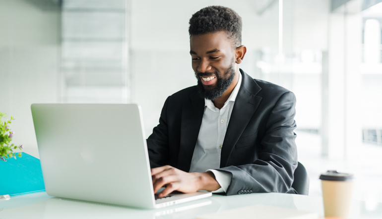 african american businessman using laptop