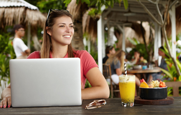 cheerful adult woman using computer