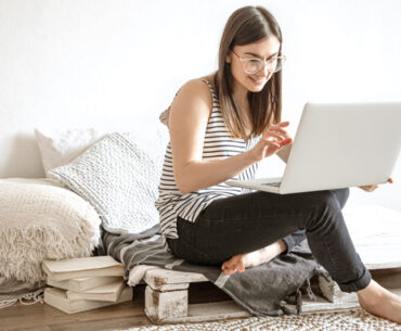 young-woman-works-remotely-computer