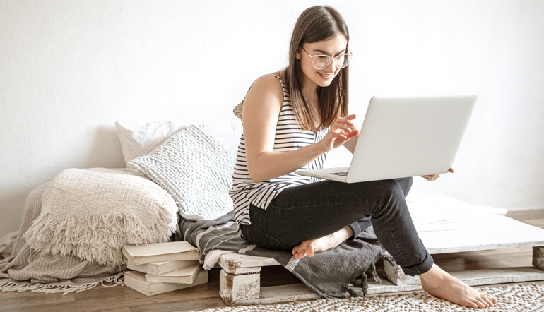 young-woman-works-remotely-computer