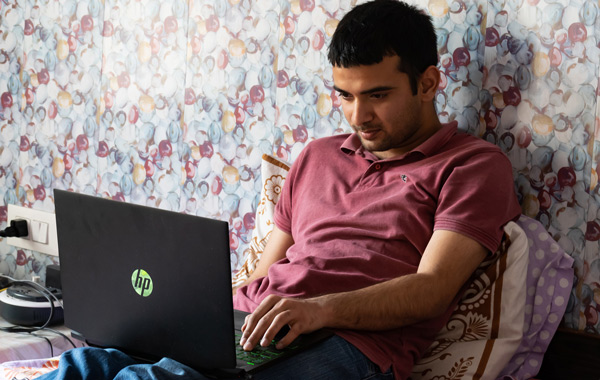 man working using laptop