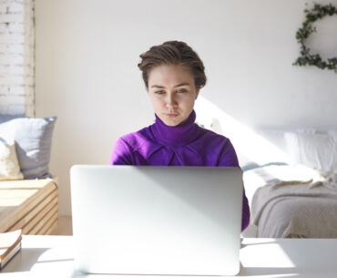 young female freelancer browsing job recruitment websites