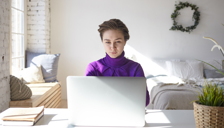 young female freelancer browsing job recruitment websites