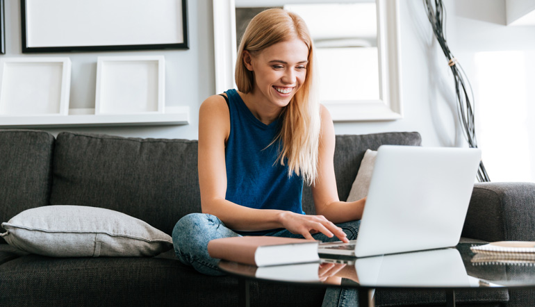 happy woman sitting sofa