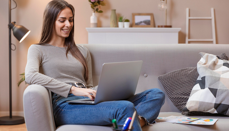 woman working from comfortable couch