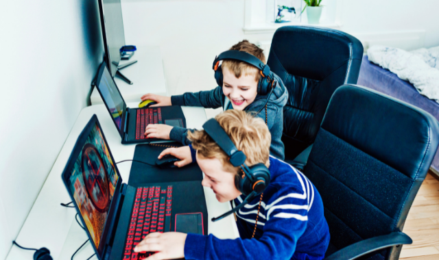 two boys playing computer games