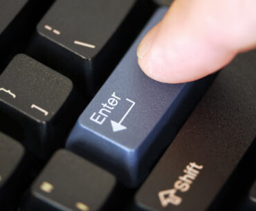 person clicking the enter botton