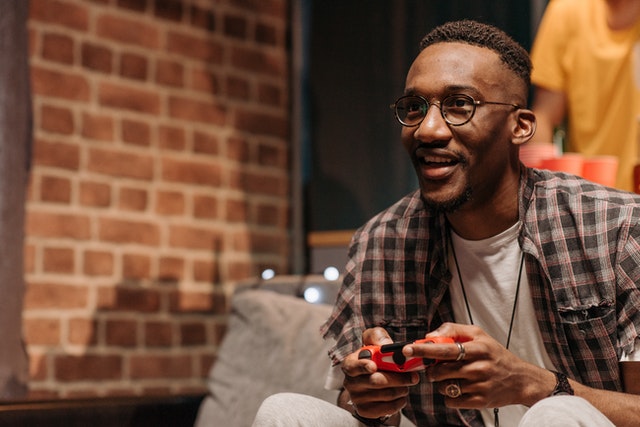 happy man playing video games
