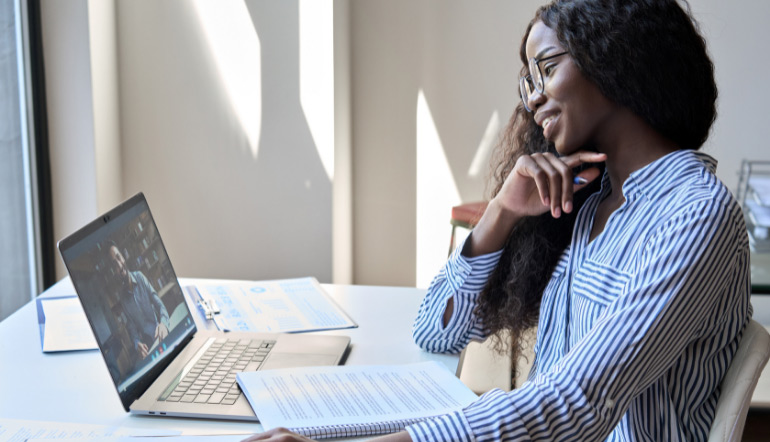 cheerful woman having virtual meeting