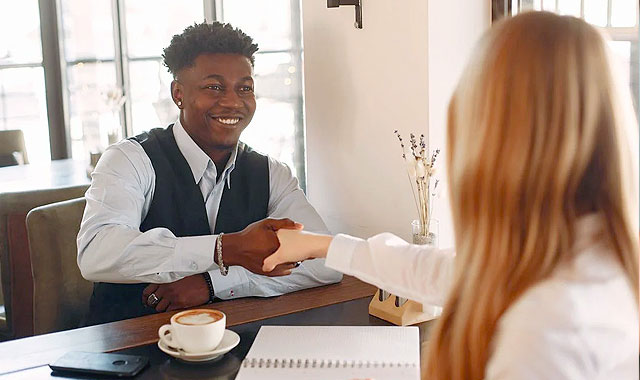 woman and man shaking hands