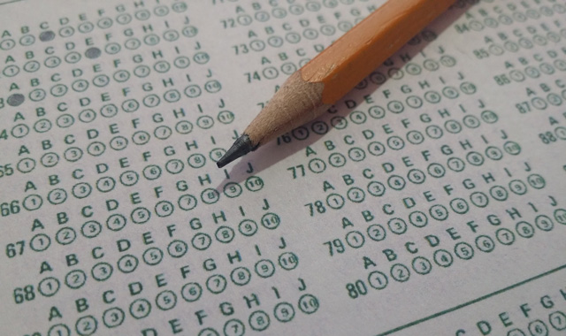 a pencil on a standardized test bubble sheet