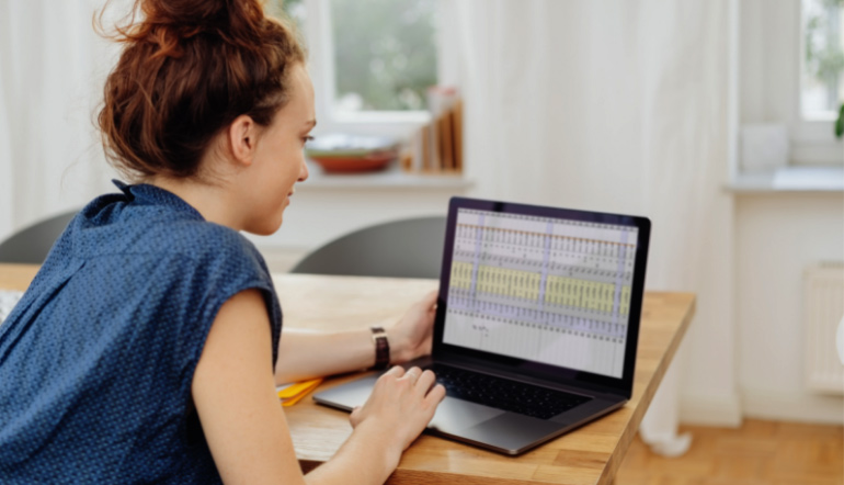 woman working using her laptop