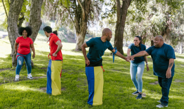 friends playing sack race