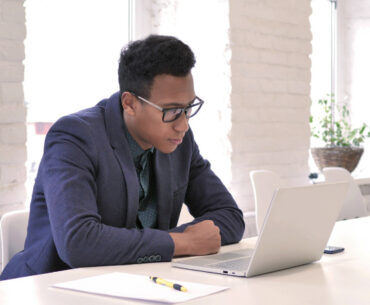 man wearing suit busy working