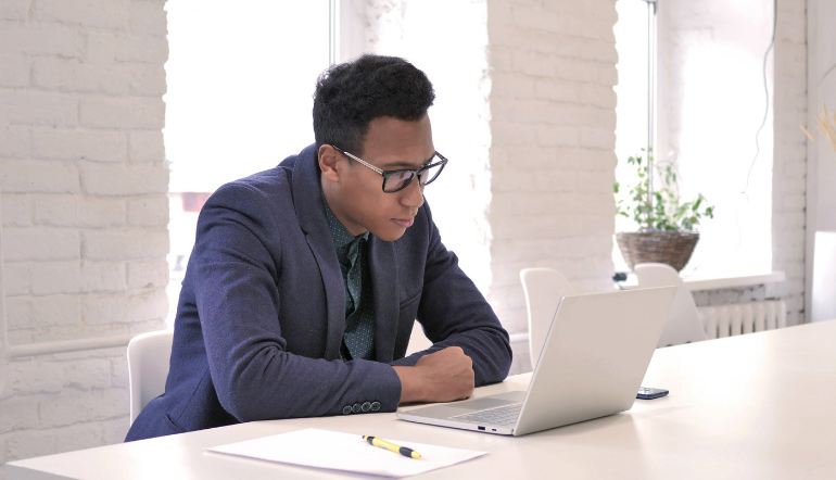 man wearing suit busy working